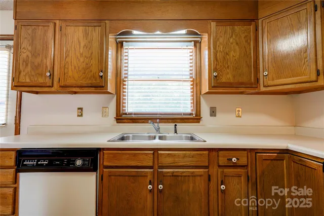 a kitchen with a sink and cabinets