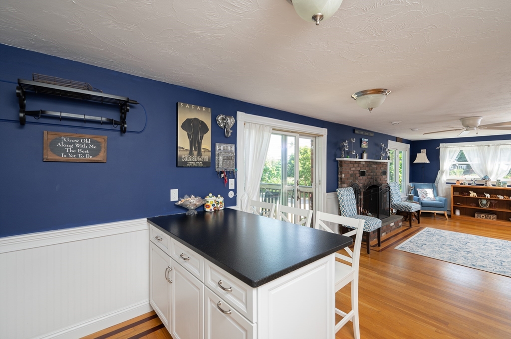 29 Wituwamat Road Weymouth, MA 02191 - Photo 16 of 42 a kitchen with a table chairs and wooden floor