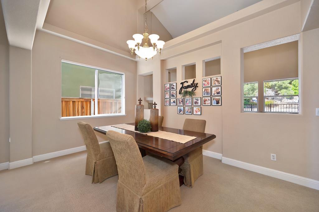 1685 Iroquois Road Rocklin, CA 95765 - Photo 12 of 73 a view of a dining room with furniture and chandelier