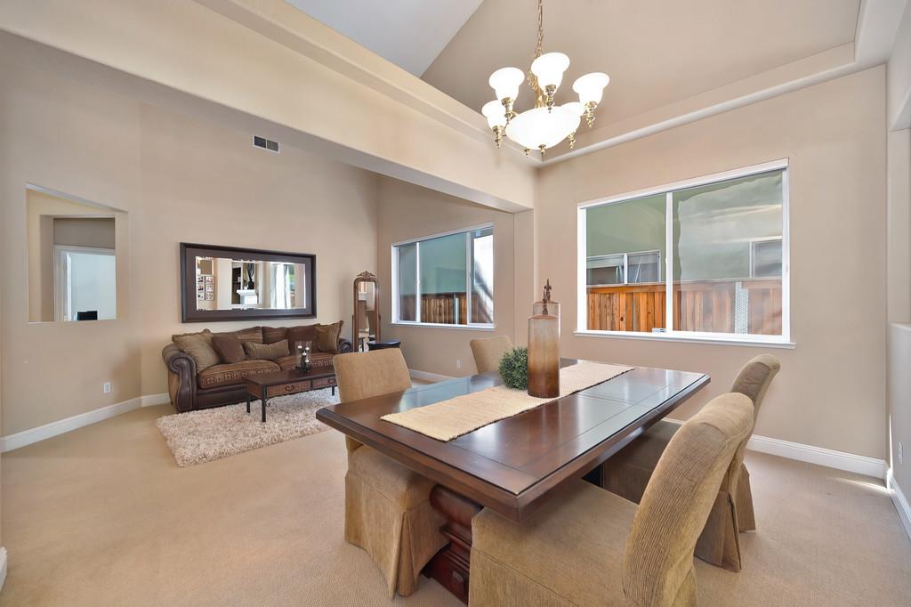1685 Iroquois Road Rocklin, CA 95765 - Photo 13 of 73 a view of a dining room with furniture and chandelier