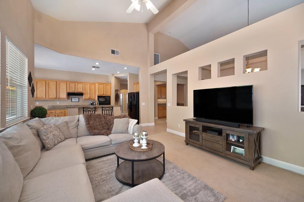 1685 Iroquois Road Rocklin, CA 95765 - Photo 19 of 73 a living room with furniture and a flat screen tv