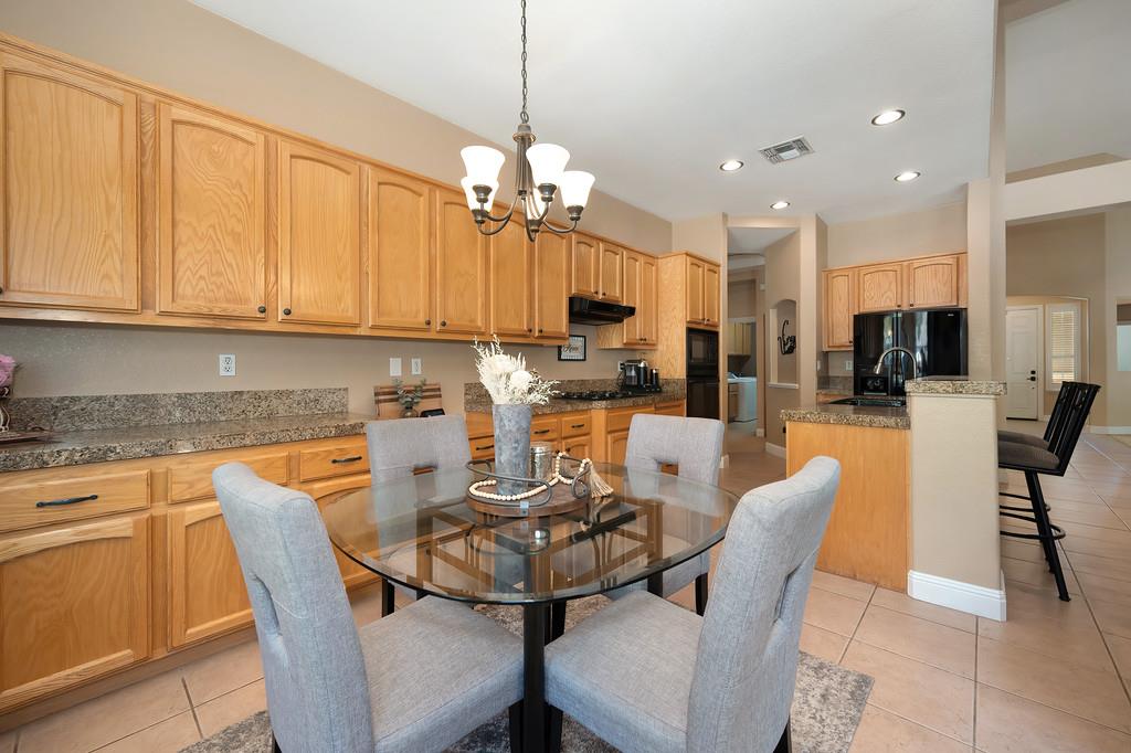 1685 Iroquois Road Rocklin, CA 95765 - Photo 27 of 73 a view of a dining room with furniture