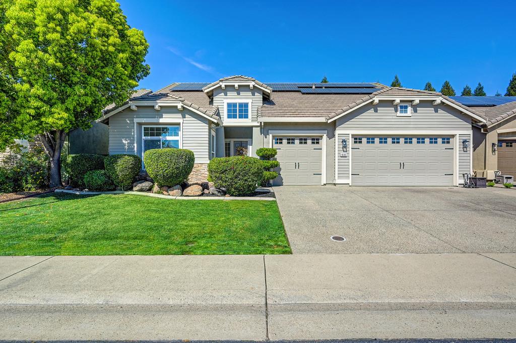 1685 Iroquois Road Rocklin, CA 95765 - Photo 4 of 73 a view of a house with a small yard and potted plants