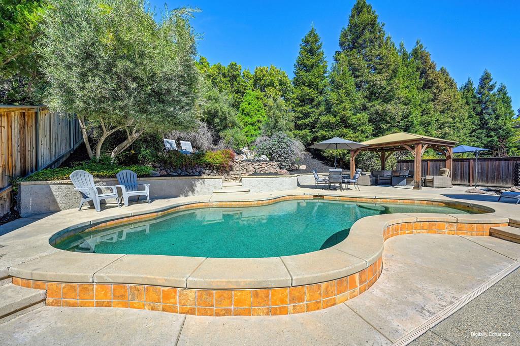 1685 Iroquois Road Rocklin, CA 95765 - Photo 7 of 73 a view of a swimming pool with a patio