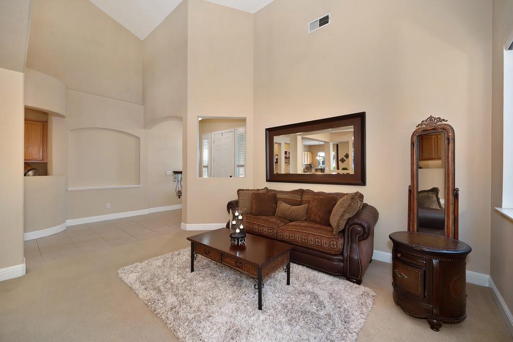 1685 Iroquois Road Rocklin, CA 95765 - Photo 10 of 73 a living room with furniture a rug and a window
