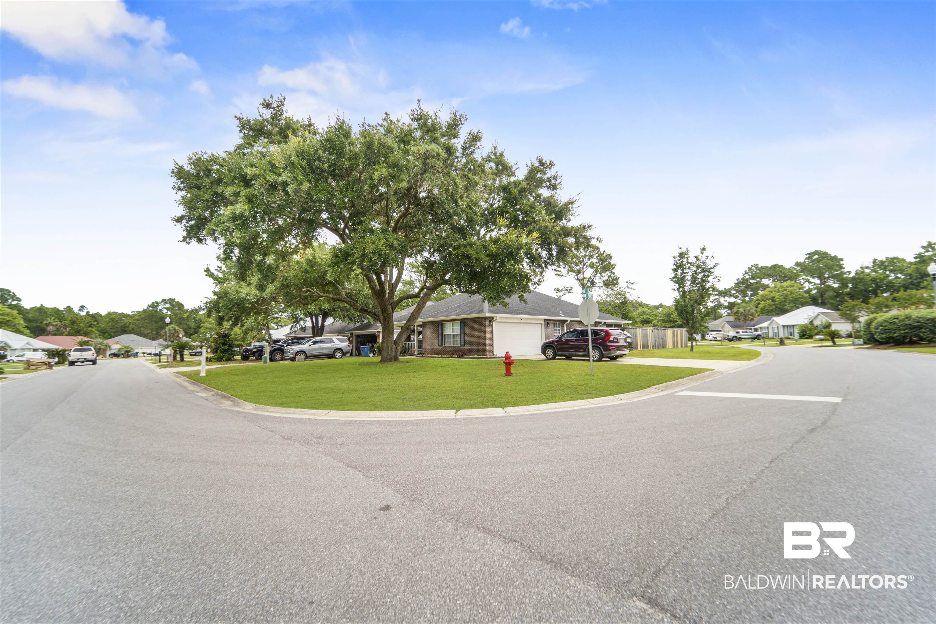 4620 Pine Boulevard Orange Beach, AL 36561 - Photo 32 of 49 View of asphalt street featuring a residential view and curbs