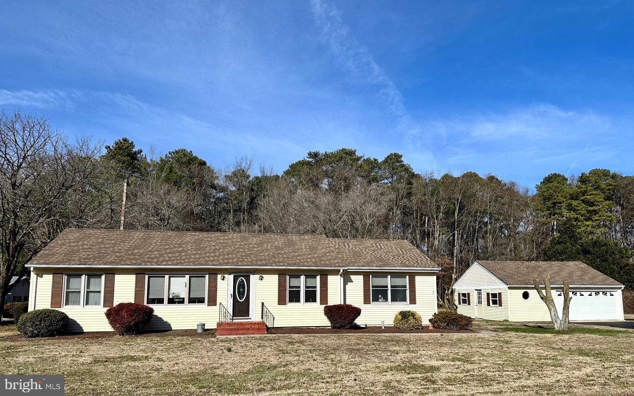 front view of a house with a yard
