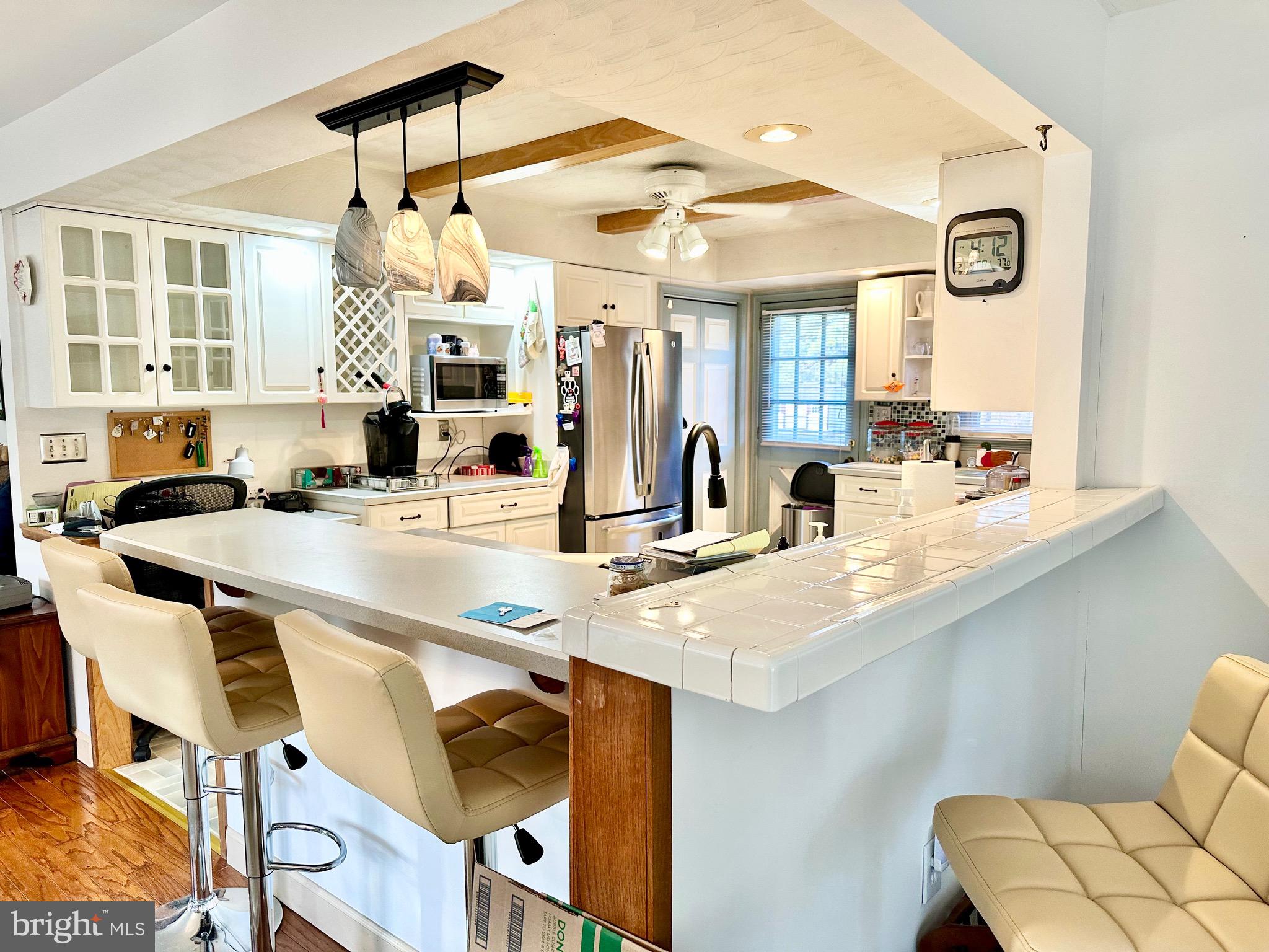 1111 Camp Road Denton, MD 21629 - Photo 20 of 33 a kitchen with a dining table and chairs