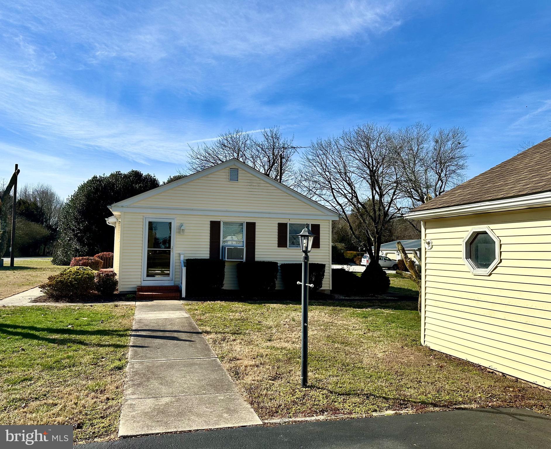 1111 Camp Road Denton, MD 21629 - Photo 2 of 33 a front view of a house with a yard
