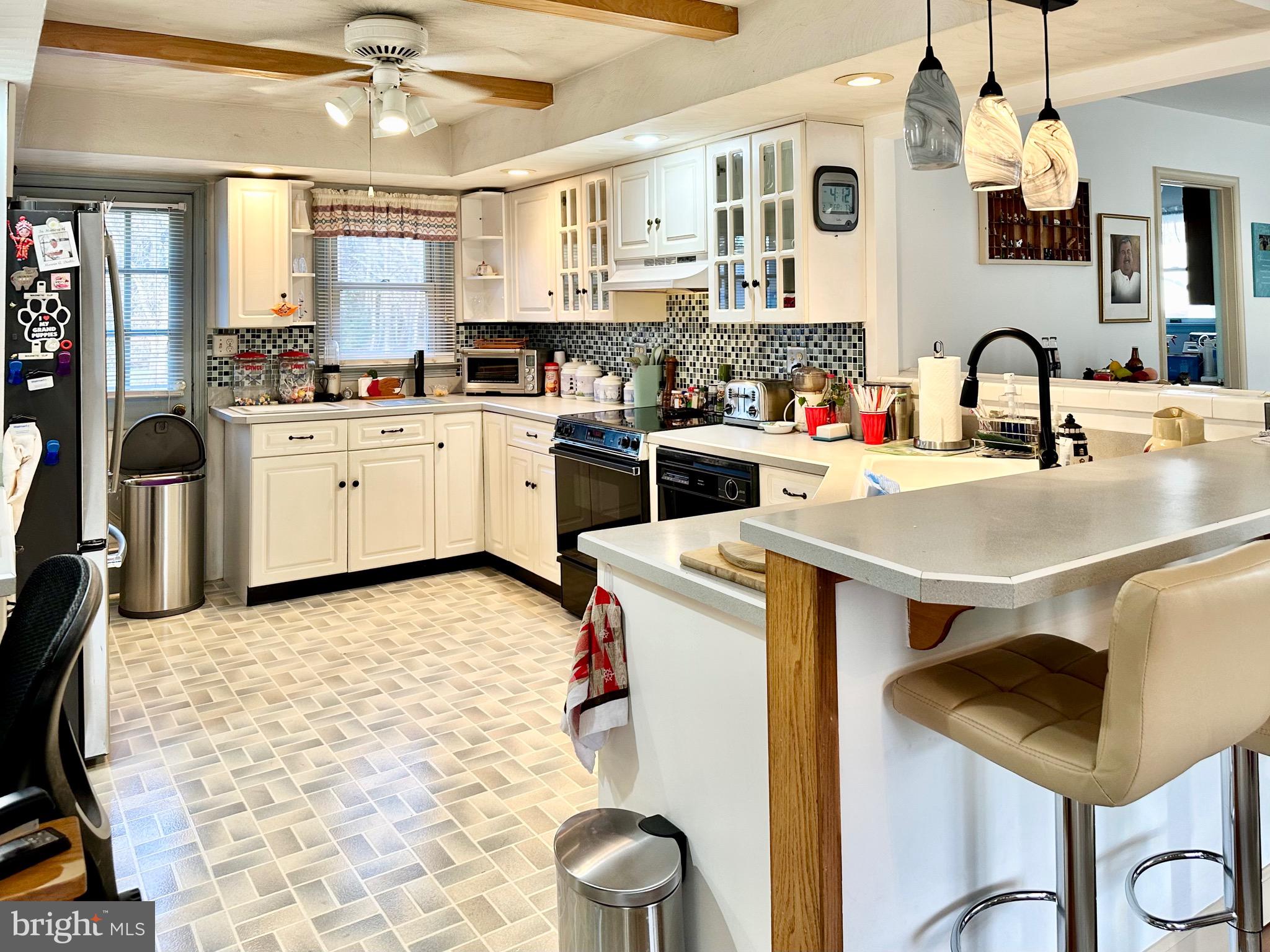 1111 Camp Road Denton, MD 21629 - Photo 21 of 33 a kitchen with a sink appliances and cabinets