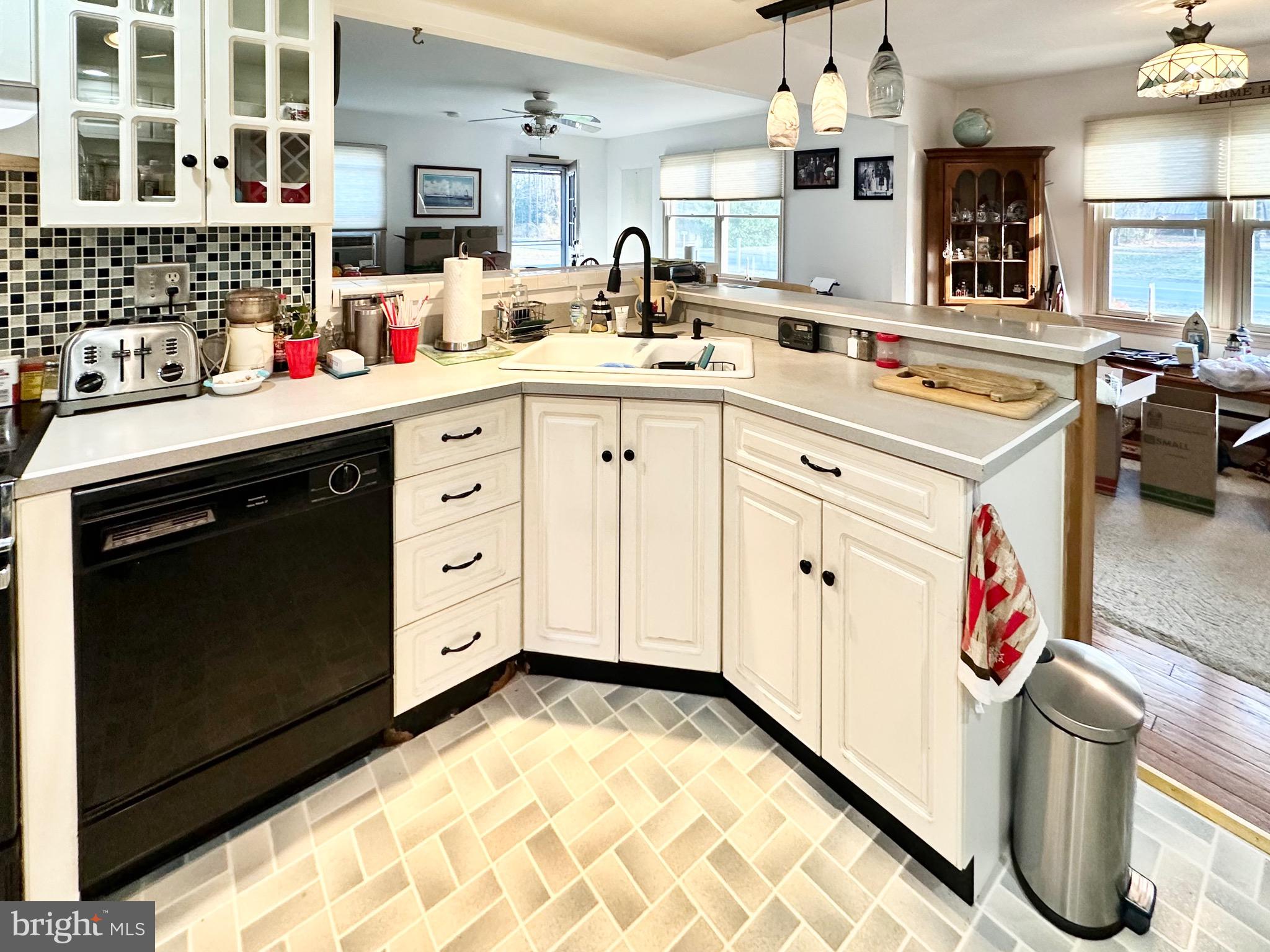 1111 Camp Road Denton, MD 21629 - Photo 23 of 33 a kitchen with a sink stove and cabinets
