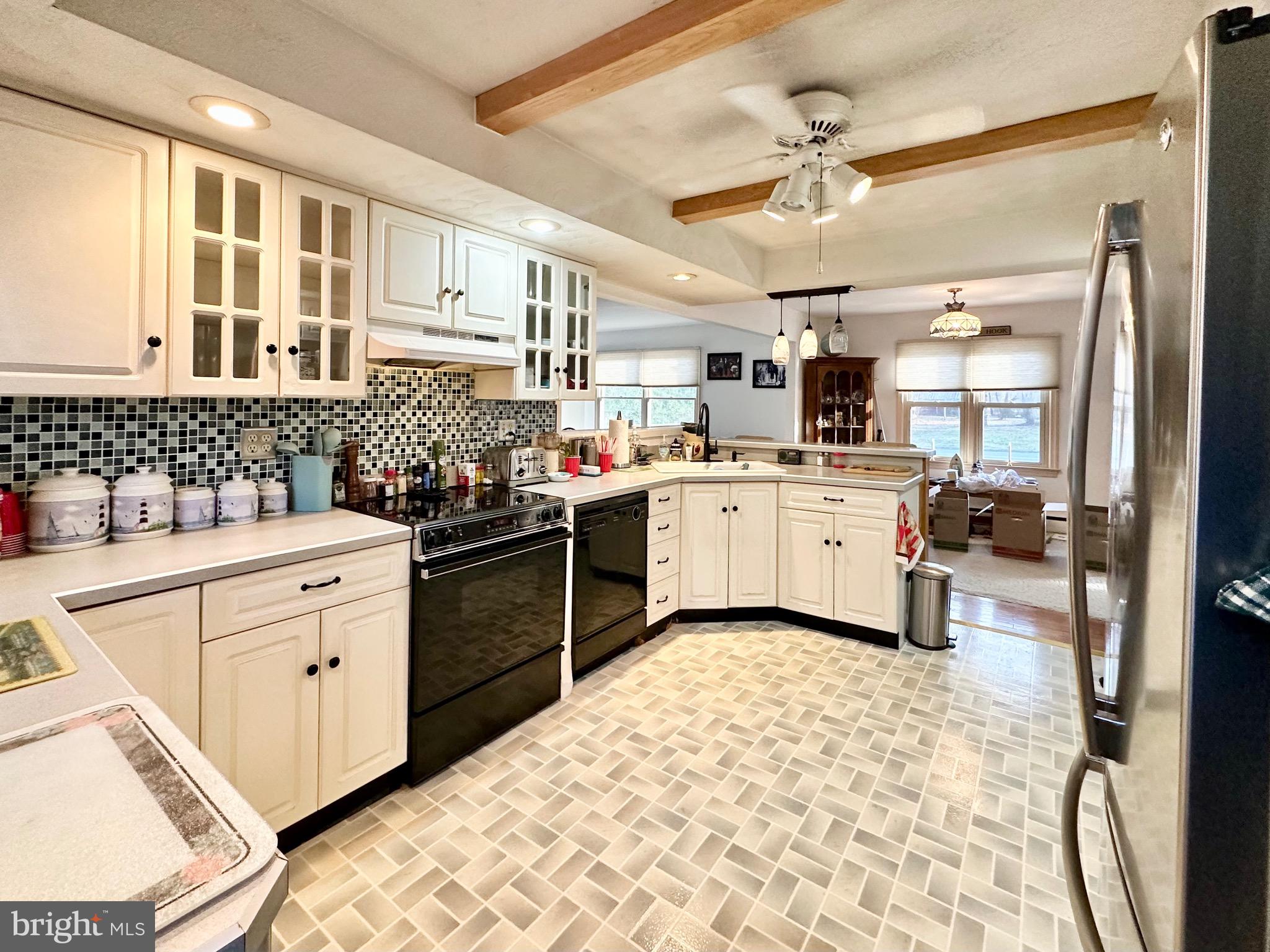 1111 Camp Road Denton, MD 21629 - Photo 28 of 33 a kitchen with a sink appliances cabinets and furniture