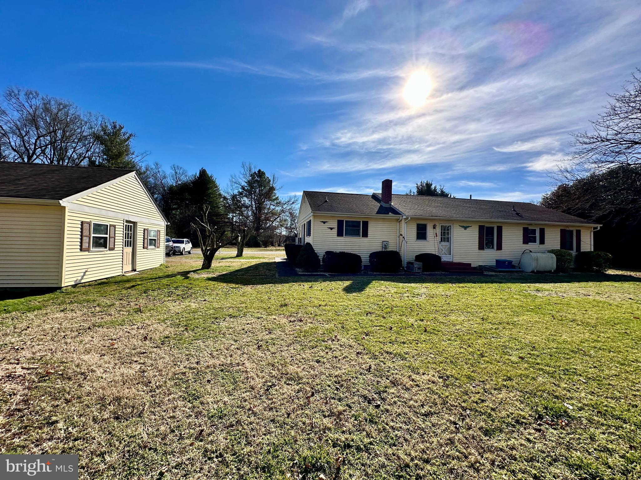1111 Camp Road Denton, MD 21629 - Photo 10 of 33 a front view of a house with a yard
