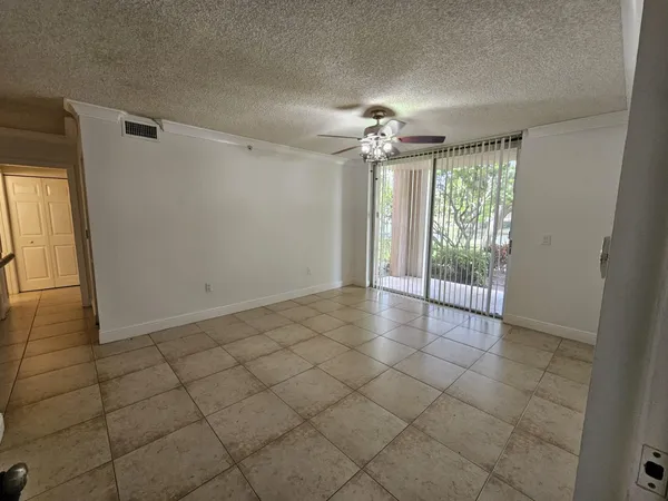 a kitchen with granite countertop a stove and a microwave