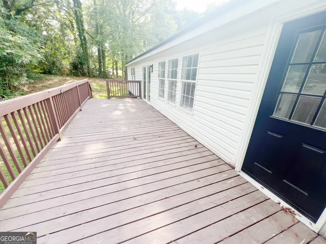 a view of a balcony with wooden floor