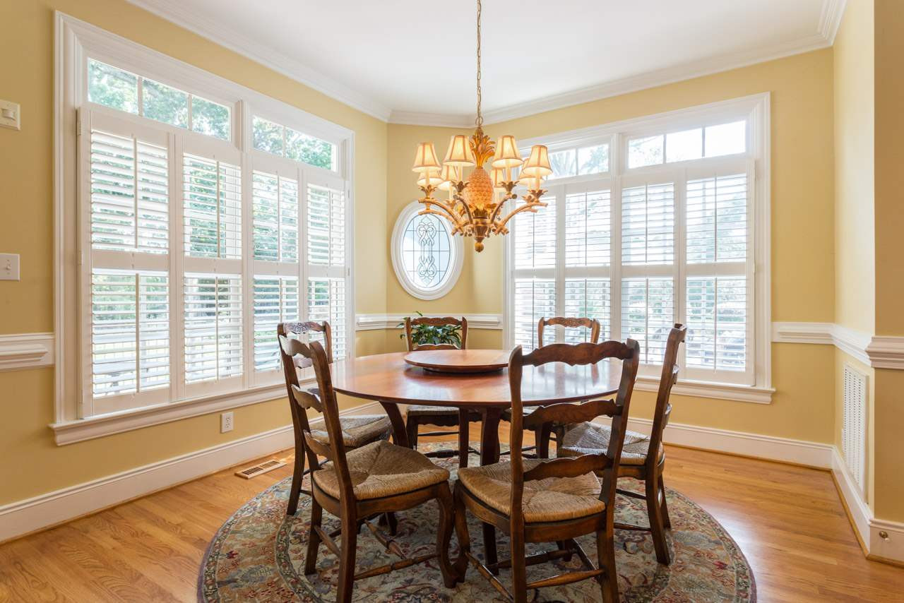 12528 Bayleaf Church Road Raleigh, NC 27614 - Photo 6 of 30 Open to Family Room, Plantation Shutters, Hardwood Floors, and Decorative Accent Window Sun-filled Breakfast Room