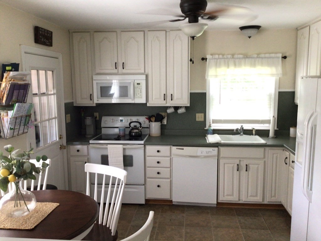 9 Inwood Road Rutland, MA 01543 - Photo 3 of 22 a kitchen with stainless steel appliances granite countertop a stove a sink dishwasher and white cabinets