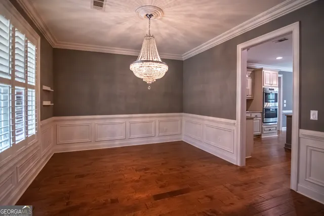 a view of room with window and hardwood floor