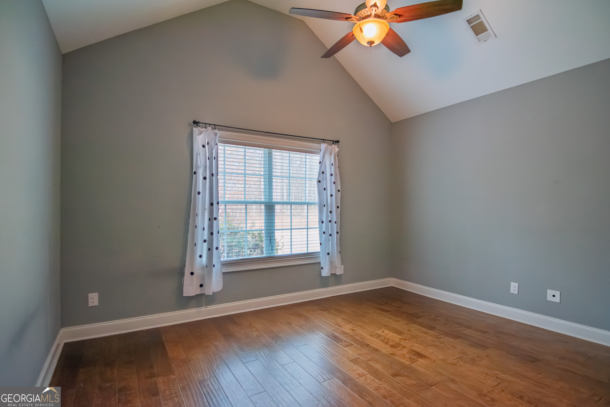 3337 Lower Blue Springs Road Hamilton, GA 31811 - Photo 15 of 41 wooden floor and window in an empty room