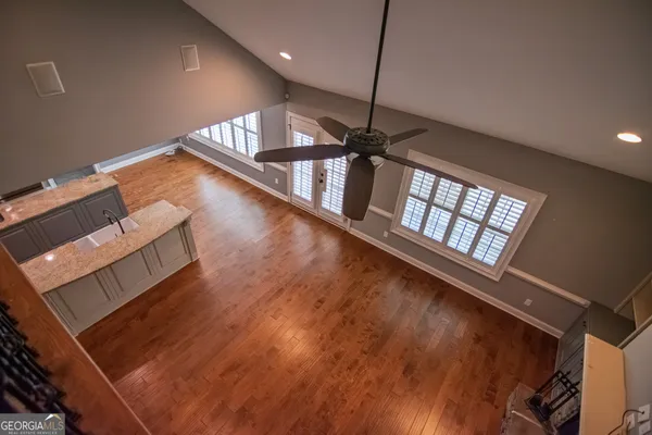 a view of an empty room with windows