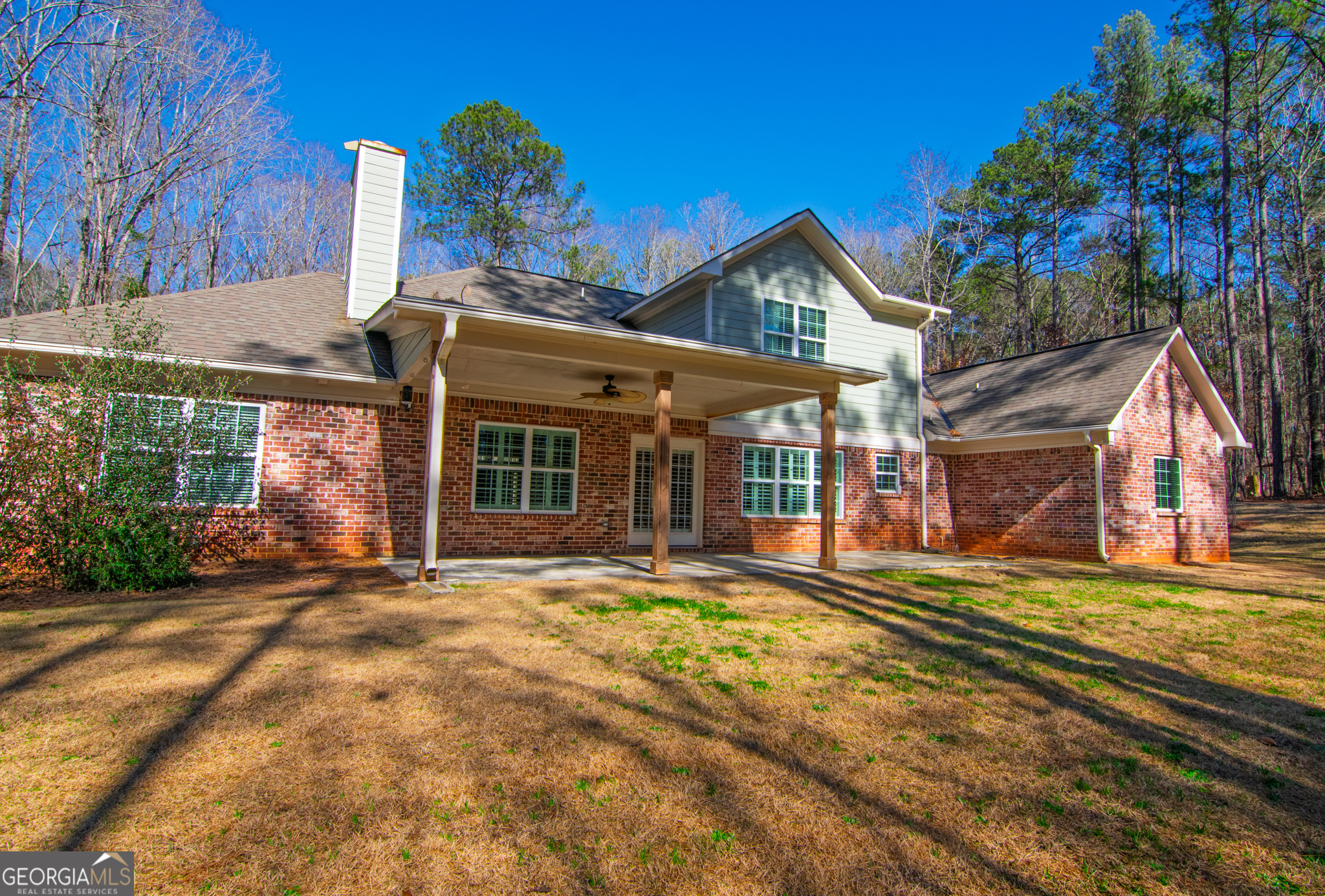 3337 Lower Blue Springs Road Hamilton, GA 31811 - Photo 32 of 41 a view of a house with a yard and potted plants