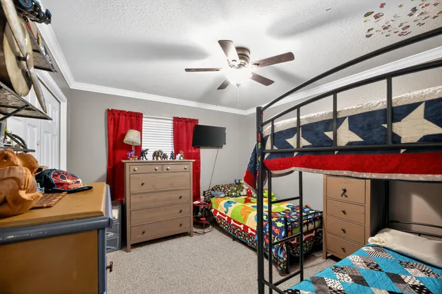 a bedroom with a bed and furniture