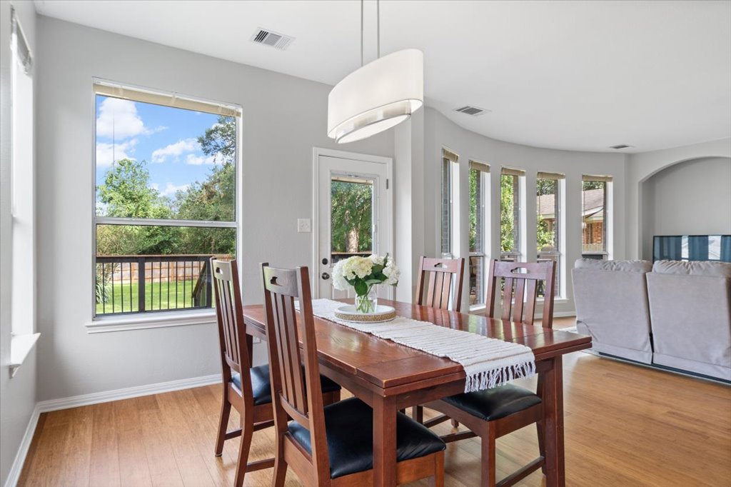 10801 Beachmont Lane Austin, TX 78739 - Photo 9 of 40 Gather with your friends and family in your spacious dining space open to the living room so everyone can hang out together!
