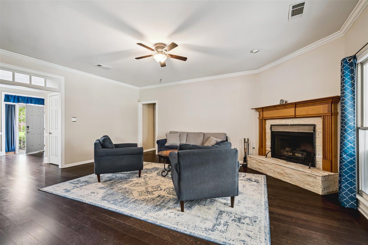 1489 John Ridge Drive Collierville, TN 38017 - Photo 11 of 39 a living room with furniture and a fireplace