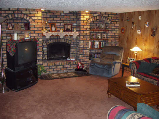 12223 Rae Ann Road Roscoe, IL 61073 - Photo 4 of 6 a view of a fireplace with workspace in living room
