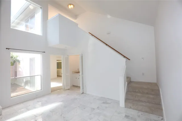 a kitchen with a sink a refrigerator and a stove