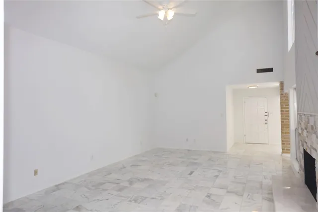 a large kitchen with kitchen island a sink stainless steel appliances and cabinets