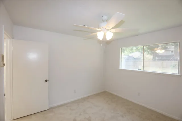 an empty room with a bathroom