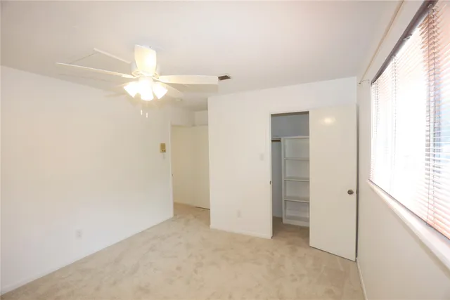 a view of a backyard with a small cabin and a chair