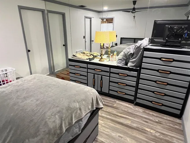 a bed sitting in a bedroom next to a window