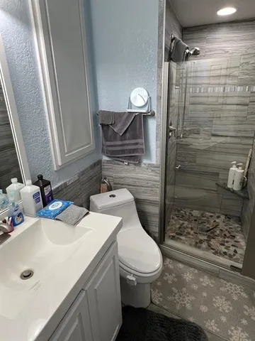 a bathroom with a sink and shower