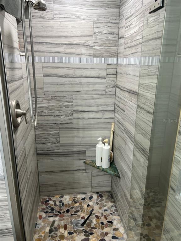 12908 Wedgewood Way, Unit D Hudson, FL 34667 - Photo 26 of 55 a bathroom with a sink and shower