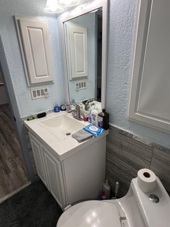 12908 Wedgewood Way, Unit D Hudson, FL 34667 - Photo 27 of 55 a bathroom with a sink and a mirror