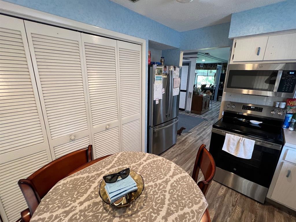 12908 Wedgewood Way, Unit D Hudson, FL 34667 - Photo 32 of 55 a bedroom with a bed and wooden floor