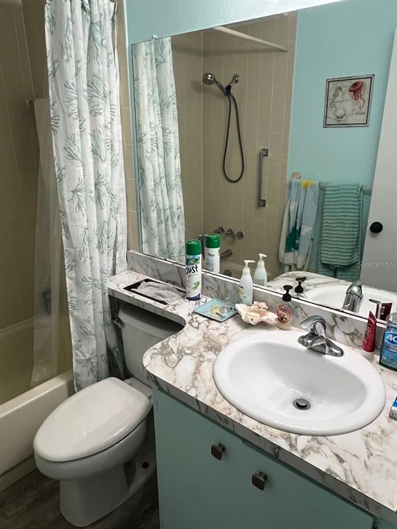 12908 Wedgewood Way, Unit D Hudson, FL 34667 - Photo 38 of 55 a bathroom with a sink toilet and shower