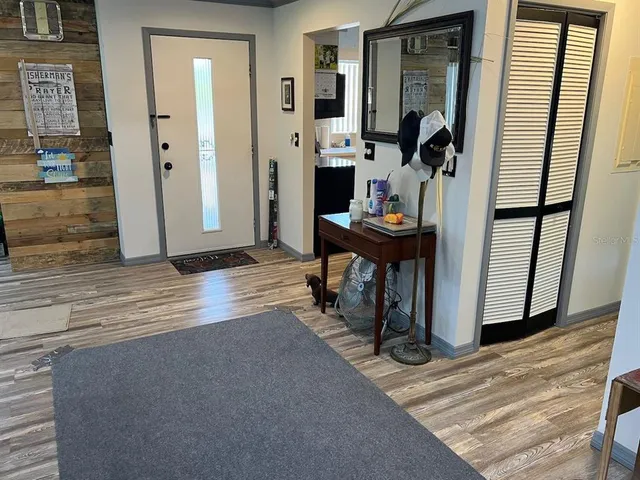 a view of a livingroom with furniture and front door