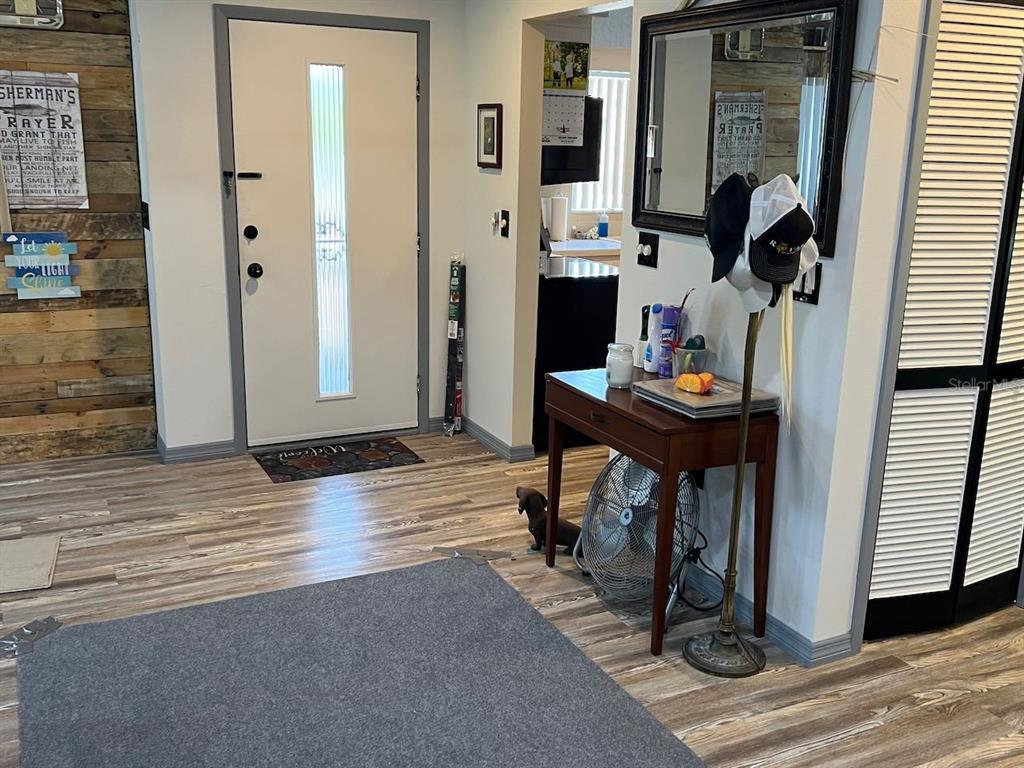 12908 Wedgewood Way, Unit D Hudson, FL 34667 - Photo 5 of 55 a view of a livingroom with furniture and front door