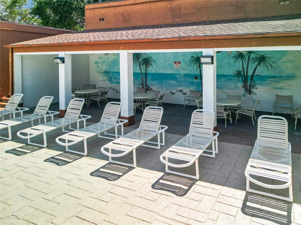 12908 Wedgewood Way, Unit D Hudson, FL 34667 - Photo 54 of 55 a outdoor space with furniture a rug and a large window