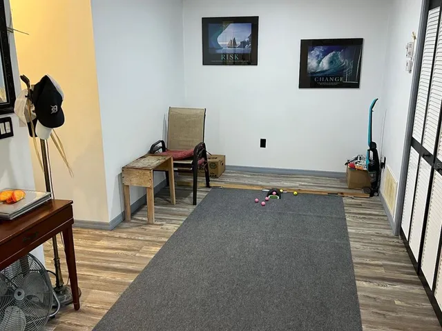 a view of a hallway with paintings on the wall