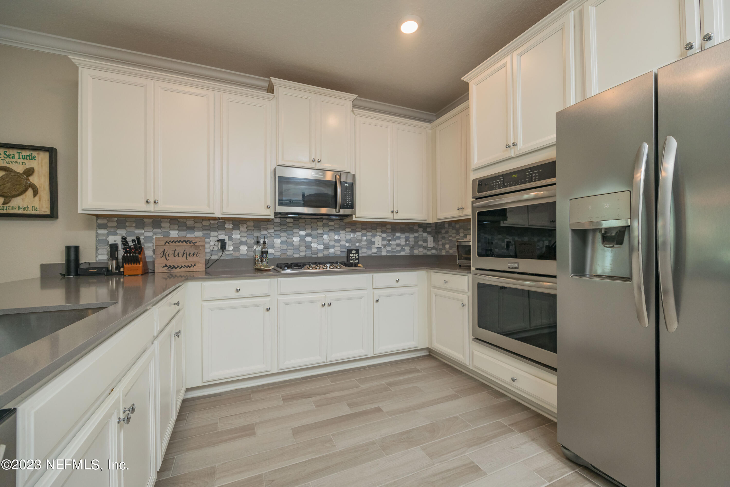 77 Glorieta Drive St. Augustine, FL 32095 - Photo 11 of 67 a kitchen with stainless steel appliances granite countertop a refrigerator sink and microwave