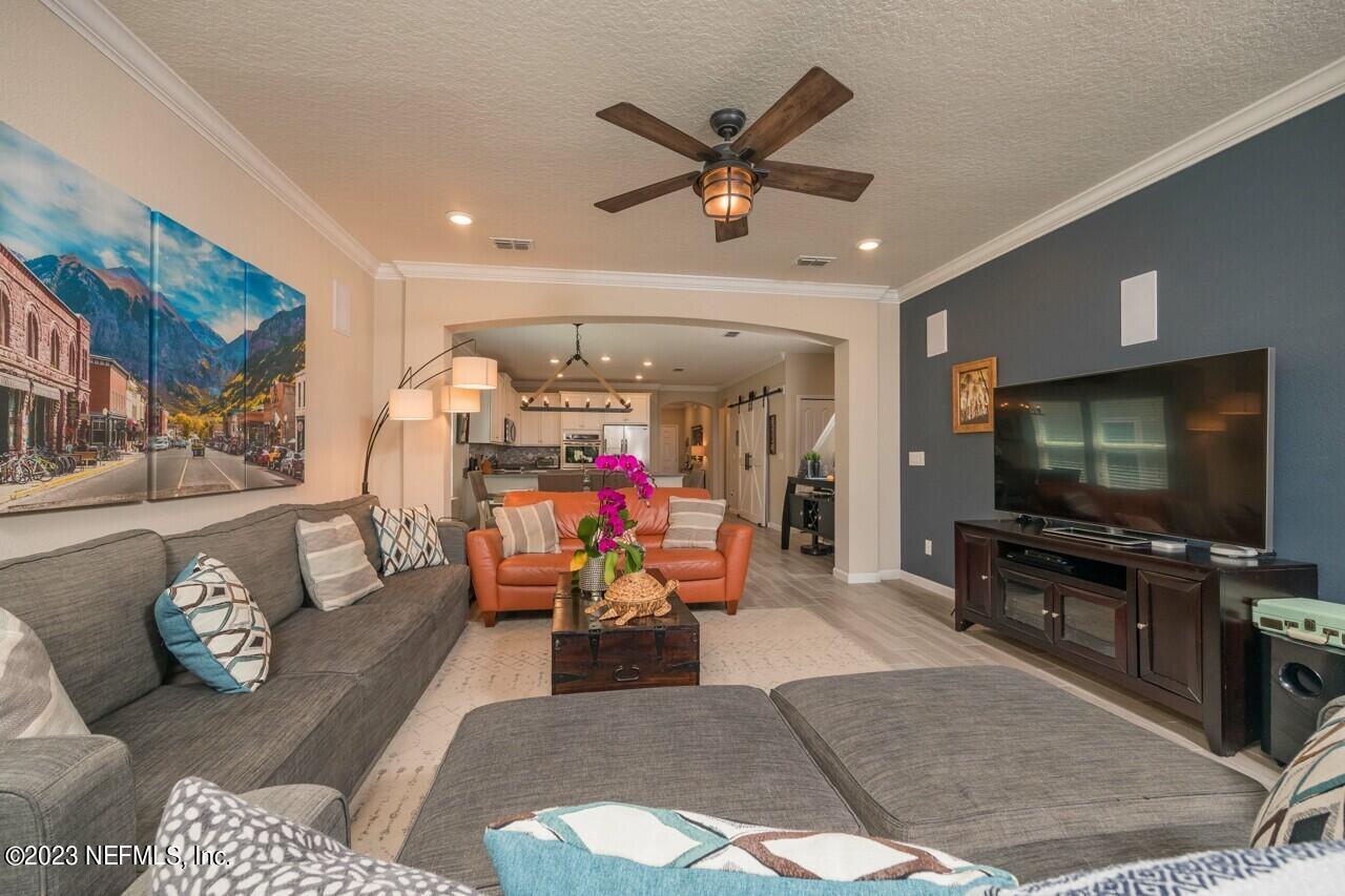 77 Glorieta Drive St. Augustine, FL 32095 - Photo 17 of 67 a living room with furniture and a flat screen tv