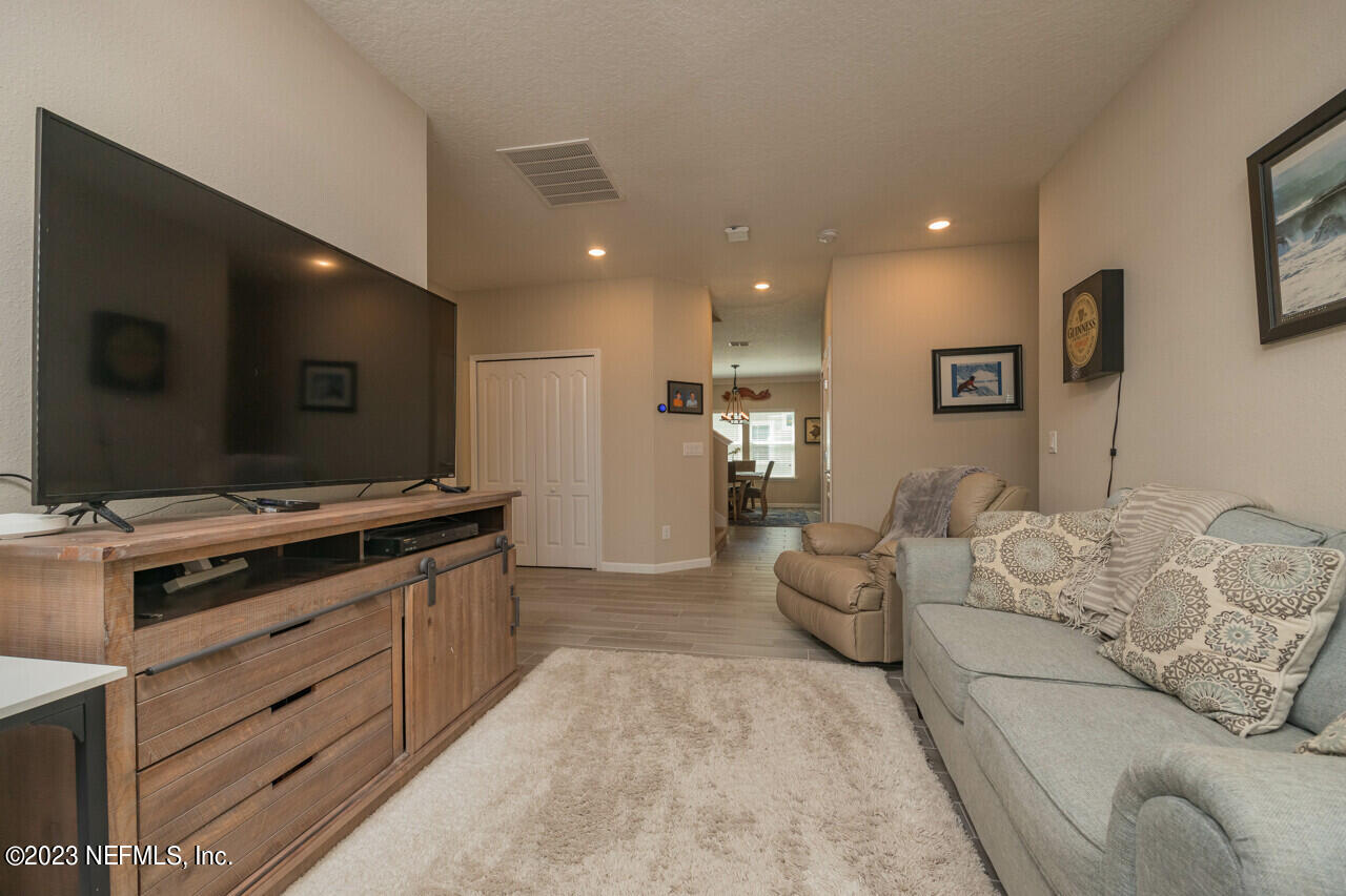 77 Glorieta Drive St. Augustine, FL 32095 - Photo 25 of 67 a living room with furniture and a flat screen tv