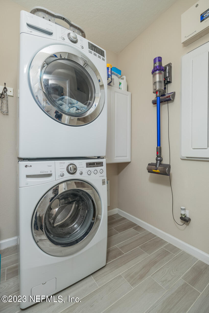 77 Glorieta Drive St. Augustine, FL 32095 - Photo 30 of 67 a utility room with sink dryer and washer