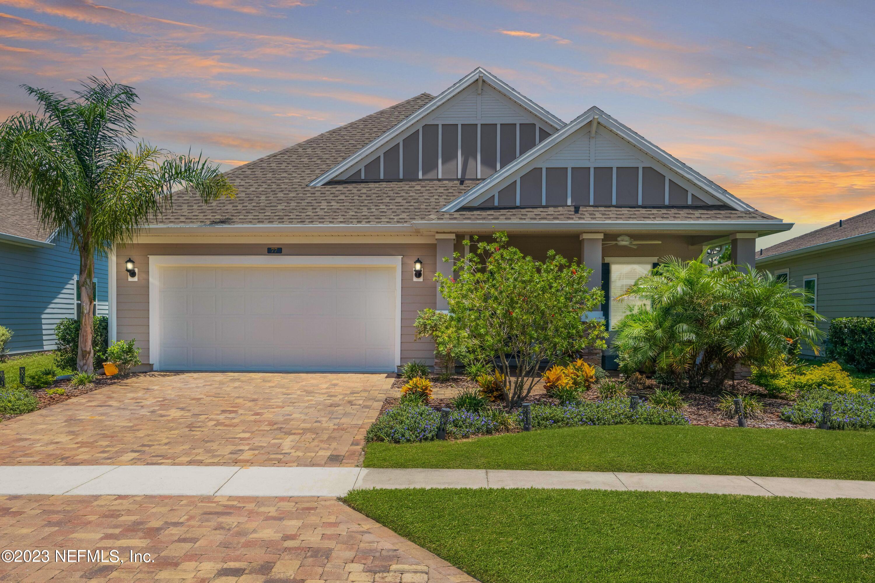 77 Glorieta Drive St. Augustine, FL 32095 - Photo 3 of 67 a front view of a house with a garden