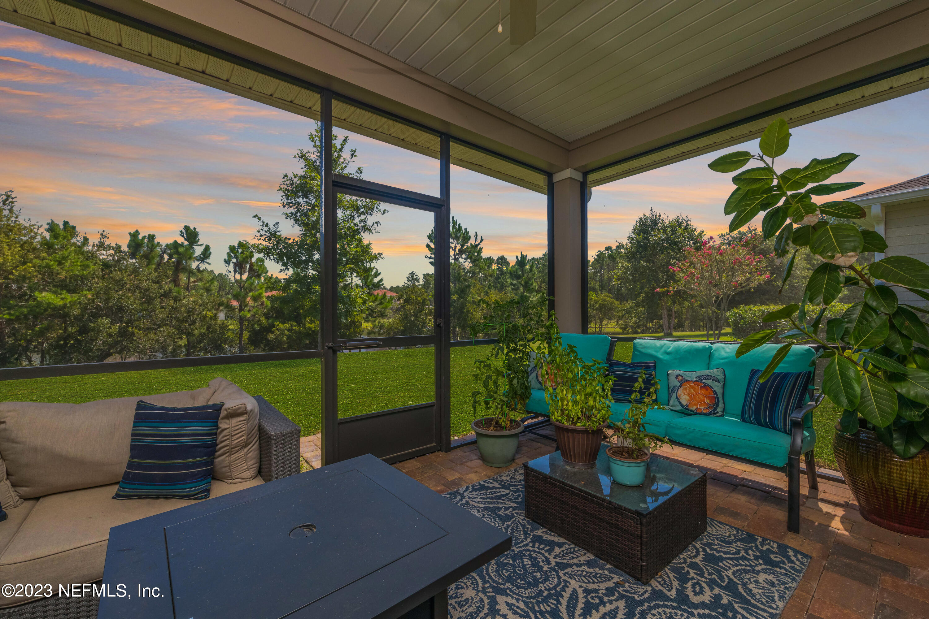 77 Glorieta Drive St. Augustine, FL 32095 - Photo 4 of 67 a view of a patio with couches chairs and a table and potted plants