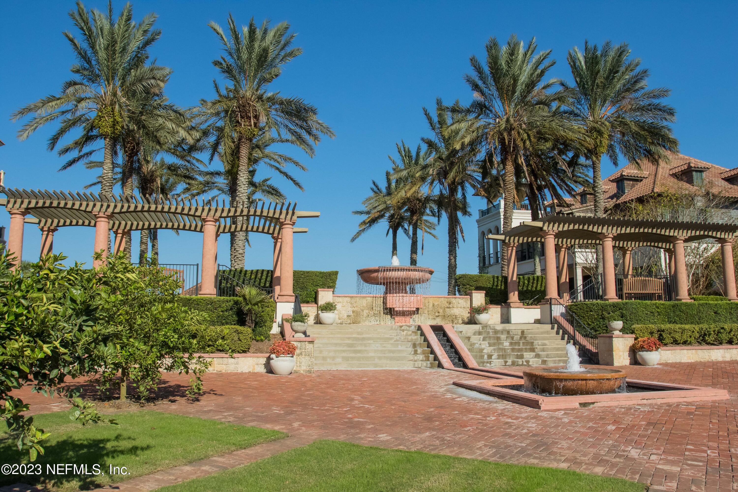 77 Glorieta Drive St. Augustine, FL 32095 - Photo 46 of 67 a front view of multiple houses with yard